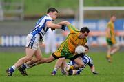 12 February 2012; Karl Lacey, Donegal, in action against Darren Strong, left, and Sean Ramsbottom, Laois. Allianz Football League, Division 1, Round 2, Donegal v Laois, O'Donnell Park, Letterkenny, Co. Donegal. Picture credit: Oliver McVeigh / SPORTSFILE