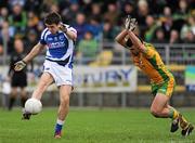 12 February 2012; Colm Begley, Laois, manages to score a point despite the efforts of Paddy McGrath, Donegal. Allianz Football League, Division 1, Round 2, Donegal v Laois, O'Donnell Park, Letterkenny, Co. Donegal. Picture credit: Oliver McVeigh / SPORTSFILE