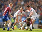 12 February 2012; David Wallis, Naomh Pádraig, Clonbur, supported by team-mate Declan Kyne, left, in action against Cathal O'Neill and Pat Campbell, right, Derrytresk Fir an Chnoic. AIB GAA Football All-Ireland Junior Club Championship Final, Naomh Pádraig, Clonbur, Galway v Derrytresk Fir an Chnoic, Tyrone, Croke Park, Dublin. Picture credit: Pat Murphy / SPORTSFILE