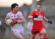 12 February 2012; Matthew Donnelly, Tyrone, in action against Enda Lynn, Derry. Allianz Football League, Division 2, Round 2, Tyrone v Derry, Healy Park, Omagh, Co Tyrone. Picture credit: Brian Lawless / SPORTSFILE