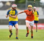 24 June 2017; Matthew Comerford of Roscommon in action against Fionntan Doonelly of Armagh during the Bank of Ireland Celtic Challenge Corn Michael Feery Final match between Armagh and Roscommon at Netwatch Cullen Park in Carlow. Photo by Seb Daly/Sportsfile
