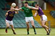 24 June 2017; Josh Ryan of Limerick in action against Jim Rossiter, left, and Brian Malone of Wexford during the GAA Football All-Ireland Senior Championship Round 1B match between Limerick and Wexford at the Gaelic Grounds in Limerick. Photo by Diarmuid Greene/Sportsfile