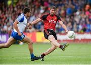 24 June 2017; Peter Turley of Down scores a point despite the attempts of Drew Wylie of Monaghan  during the Ulster GAA Football Senior Championship Semi-Final match between Down and Monaghan at the Athletic Grounds in Armagh. Photo by Oliver McVeigh/Sportsfile