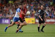 24 June 2017; Peter Turley of Down in action against Neil Mc Adam of Monaghan as Referee David Coldrick looks on  during the Ulster GAA Football Senior Championship Semi-Final match between Down and Monaghan at the Athletic Grounds in Armagh. Photo by Oliver McVeigh/Sportsfile