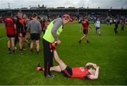 24 June 2017; Down manager Eamonn Burns helps Kevin McKernan of Down with cramp after the Ulster GAA Football Senior Championship Semi-Final match between Down and Monaghan at the Athletic Grounds in Armagh. Photo by Daire Brennan/Sportsfile