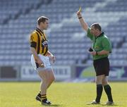 1 April 2007; Referee Eugene Murtagh shows John McEntee, Crossmaglen Rangers, a yellow card. AIB All-Ireland Club Football Championship Final Replay, Dr Crokes v Crossmaglen Rangers, O'Moore Park, Portlaoise, Co. Laois. Picture credit: Brian Lawless / SPORTSFILE