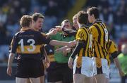 1 April 2007; Referee Eugene Murtagh mediates between players from both sides. AIB All-Ireland Club Football Championship Final Replay, Dr Crokes v Crossmaglen Rangers, O'Moore Park, Portlaoise, Co. Laois. Picture credit: Brian Lawless / SPORTSFILE