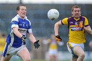 29 January 2012; Kevin Meahey, Laois, in action against Andrew Shore, Wexford. Bord Na Mona O'Byrne Shield Final, Wexford v Laois, Wexford Park, Wexford. Picture credit: Matt Browne / SPORTSFILE