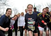 17 February 2012; European Cross Country Champion Fionnuala Britton with participants, including Henry McKean of Newstalk, right, who turned up for the SPAR Great Ireland Run flash lap lunchtime run around Merrion Square. The SPAR Great Ireland Run is on Sunday 15th April in the Phoenix Park, Dublin. Entries and info at www.greatirelandrun.org. Merrion Square, Dublin. Picture credit: Brian Lawless / SPORTSFILE