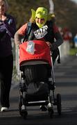 18 February 2012; Jane Boyle, from Clonmel, Co. Tipperary, pushes a pram carrying her son Alwin during the Operation Transformation Race 2012. Phoenix Park, Dublin. Picture credit: Pat Murphy / SPORTSFILE