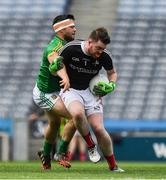 25 June 2017; Louth goalkeeper Robert Samson is tackled by Meath's Dean Maguire during the Leinster GAA Football Junior Championship Final match between Louth and Meath at Croke Park in Dublin. Photo by Ray McManus/Sportsfile