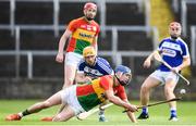 25 June 2017; Diarmuid Byrne of Carlow in action against Cahir Healy of Laois during the GAA Hurling All-Ireland Senior Championship Preliminary Round match between Laois and Carlow at O'Moore Park in Portlaoise, Co. Laois. Photo by Ramsey Cardy/Sportsfile