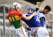 25 June 2017; Martin Kavanagh of Carlow tussles with Lee Cleere of Laois during the GAA Hurling All-Ireland Senior Championship Preliminary Round match between Laois and Carlow at O'Moore Park in Portlaoise, Co. Laois. Photo by Ramsey Cardy/Sportsfile