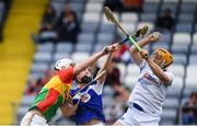 25 June 2017; Chris Nolan of Carlow in action against Donncha Hartnett, centre, and Enda Rowland of Laois during the GAA Hurling All-Ireland Senior Championship Preliminary Round match between Laois and Carlow at O'Moore Park in Portlaoise, Co. Laois. Photo by Ramsey Cardy/Sportsfile