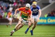 25 June 2017; James Doyle of Carlow in action against Leigh Bergin of Laois during the GAA Hurling All-Ireland Senior Championship Preliminary Round match between Laois and Carlow at O'Moore Park in Portlaoise, Co. Laois. Photo by Ramsey Cardy/Sportsfile