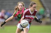25 June 2017; Aoibhe Conaty of Castlerahan-Denn GAA Club, Co. Cavan in action against Julia Kelleher of Glanmire GAA Club, Co. Cork during the Girls Division 1 Final at the John West Peile na nÓg national competition which took place this weekend across Cavan, Fermanagh and Monaghan. This is the second year that the Féile na nGael and Féile Peile na nÓg have been sponsored by John West, one of the world’s leading suppliers of fish. The competition gives up-and-coming GAA superstars the chance to participate and play in their respective Féile tournament, at a level which suits their age, skills and strengths.   Photo by Matt Browne/Sportsfile