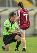 25 June 2017; Referee Maggie Farrely ties the boot laces of Aoibhe Conaty of Castlerahan-Denn GAA Club, Co. during the game against Glanmire GAA Club, Co. Cork at the Girls Division 1 Final at the John West Peile na nÓg national competition which took place this weekend across Cavan, Fermanagh and Monaghan. This is the second year that the Féile na nGael and Féile Peile na nÓg have been sponsored by John West, one of the world’s leading suppliers of fish. The competition gives up-and-coming GAA superstars the chance to participate and play in their respective Féile tournament, at a level which suits their age, skills and strengths.   Photo by Matt Browne/Sportsfile