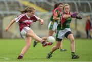 25 June 2017; Aisling McEnroe of Castlerahan-Denn GAA Club, Co. Cavan in action against Olivia McAllen of Glanmire GAA Club, Co. Cork during the Girls Division 1 Final at the John West Peile na nÓg national competition which took place this weekend across Cavan, Fermanagh and Monaghan. This is the second year that the Féile na nGael and Féile Peile na nÓg have been sponsored by John West, one of the world’s leading suppliers of fish. The competition gives up-and-coming GAA superstars the chance to participate and play in their respective Féile tournament, at a level which suits their age, skills and strengths.   Photo by Matt Browne/Sportsfile