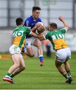25 June 2017; Gerard Smith of Cavan is tackled by Ruairi McNamee, left, and Ruairi Allen of Offaly during the GAA Football All-Ireland Senior Championship Round 1B match between Offaly and Cavan at O'Connor Park in Tullamore, Co. Offaly. Photo by Ramsey Cardy/Sportsfile