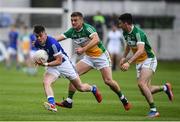 25 June 2017; Gerard Smith of Cavan is tackled by Ruairi McNamee, left, and Ruairi Allen of Offaly during the GAA Football All-Ireland Senior Championship Round 1B match between Offaly and Cavan at O'Connor Park in Tullamore, Co. Offaly. Photo by Ramsey Cardy/Sportsfile