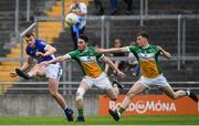 25 June 2017; Liam Buchanan of Cavan in action against Sean Pender, centre, and Sean Pender of Offaly during the GAA Football All-Ireland Senior Championship Round 1B match between Offaly and Cavan at O'Connor Park in Tullamore, Co. Offaly. Photo by Ramsey Cardy/Sportsfile