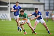 25 June 2017; Michael Brazil of Offaly is tackled by Gerard Smith of Cavan during the GAA Football All-Ireland Senior Championship Round 1B match between Offaly and Cavan at O'Connor Park in Tullamore, Co. Offaly. Photo by Ramsey Cardy/Sportsfile