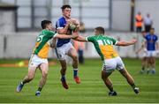 25 June 2017; Gerard Smith of Cavan is tackled by Ruairi McNamee, left, and Ruairi Allen of Offaly during the GAA Football All-Ireland Senior Championship Round 1B match between Offaly and Cavan at O'Connor Park in Tullamore, Co. Offaly. Photo by Ramsey Cardy/Sportsfile