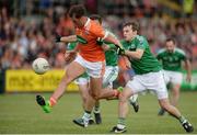 25 June 2017; Stephen Sheridan of Armagh  in action against Ryan McCluskey and Declan McCusker of Fermanagh during the GAA Football All-Ireland Senior Championship Round 1B match between Armagh and  Fermanagh at the Athletic Grounds in Armagh. Photo by Oliver McVeigh/Sportsfile
