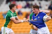 25 June 2017; Michael Brazil, left, and Nigel Dunne of Offaly tussle with Ciaran Brady of Cavan during the GAA Football All-Ireland Senior Championship Round 1B match between Offaly and Cavan at O'Connor Park in Tullamore, Co. Offaly. Photo by Ramsey Cardy/Sportsfile