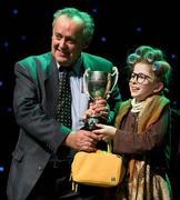 18 February 2012; Roisín Ní Bhrádaig, St Patrick's GAA Club, Palmerstown, Dublin, who won the All-Ireland Title for 'Recitation / Storytelling' in the All-Ireland Scór na nÓg Final 2012, is presented with the cup by Paddy Naughton, Cathaoirleach, Comhairle Connacht. Royal Theatre & Events Centre, Castlebar, Co. Mayo. Picture credit: Ray McManus / SPORTSFILE
