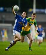 5 April 2017; Conor Bradley of Cavan in action against Tony McCleneghan of Donegal during the EirGrid Ulster GAA Football U21 Championship Semi-Final match between Cavan and Donegal at Brewster Park in Enniskillen, Co Fermanagh. Photo by Piaras Ó Mídheach/Sportsfile