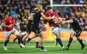 27 June 2017; Iain Henderson of the British & Irish Lions is tackled by Brad Shields, left, and Mark Abbott of of the Hurricanes during the match between Hurricanes and the British & Irish Lions at Westpac Stadium in Wellington, New Zealand. Photo by Stephen McCarthy/Sportsfile