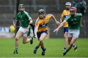 28 June 2017; Gary Cooney of Clare in action against Dylan O'Shea, left, and Dan Minehan of Limerick during the Electric Ireland Munster GAA Hurling Minor Championship semi-final match between Clare and Limerick at Cusack Park in Ennis, Co. Clare. Photo by Diarmuid Greene/Sportsfile