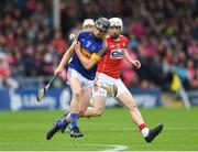 29 June 2017; Michael Purcell of Tipperary in action against Evan Sheehan of Cork during the Electric Ireland Munster GAA Hurling Minor Championship Semi-Final match between Tipperary and Cork at Semple Stadium in Thurles, Co Tipperary. Photo by Eóin Noonan/Sportsfile