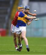 29 June 2017; Darragh Woods of Tipperary in action against Eoin Roche of Cork during the Electric Ireland Munster GAA Hurling Minor Championship Semi-Final match between Tipperary and Cork at Semple Stadium in Thurles, Co Tipperary. Photo by Eóin Noonan/Sportsfile