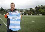 30 June 2017; Blackrock College Senior Cup Team and Development Squad got a chance to train with All Blacks stars Israel Dagg, Joe Moody and Sam Cane at Old Boys University Rugby Club in Wellington today thanks to AIG Insurance. AIG is helping to support the Dublin school’s trip to New Zealand and is also proud sponsor of the All Blacks. Pictured during the Blackrock College training session is Sam Cane of the New Zealand All Blacks holding a Blackrock College jersey. Photo by Stephen McCarthy/Sportsfile