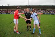 11 February 2012; Johnny Campbell, Loughgiel Shamrocks, shakes hands with Kieran Bermingham, Na Piarsaigh, right, in front of referee Anthony Stapleton before the game. AIB GAA Hurling All-Ireland Senior Club Championship Semi-Final, Loughgiel Shamrocks, Antrim v Na Piarsaigh, Limerick, Parnell Park, Dublin. Picture credit: Ray McManus / SPORTSFILE