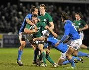 24 February 2012; JJ Hanrahan, Ireland, with support from team-mate Christopher Farrell, is tackled by Andrea Bettin, left, and Ricardo Della Rossa, right, Italy. U20 Six Nations Rugby Championship, Ireland v Italy, Dubarry Park, Athlone, Co. Westmeath. Picture credit: Barry Cregg / SPORTSFILE