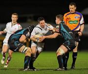 24 February 2012; Paddy Wallace, Ulster, is tackled by James King and Sam Lewis, Ospreys. Celtic League, Ulster v Ospreys, Ravenhill Park, Belfast, Co. Antrim. Picture credit: Oliver McVeigh / SPORTSFILE