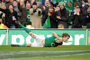 25 February 2012; Andrew Trimble, Ireland, goes over to score his side's fifth try. RBS Six Nations Rugby Championship, Ireland v Italy, Aviva Stadium, Lansdowne Road, Dublin. Picture credit: Ray McManus / SPORTSFILE