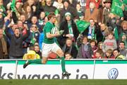 25 February 2012; Andrew Trimble, Ireland, races up the line on his way to scoring his side's fifth try. RBS Six Nations Rugby Championship, Ireland v Italy, Aviva Stadium, Lansdowne Road, Dublin. Picture credit: Ray McManus / SPORTSFILE