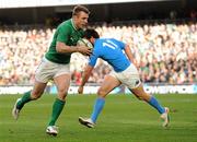 25 February 2012; Tommy Bowe, Ireland, goes past the tackle of Luke McLean, Italy, on his way to scoring his side's third try. RBS Six Nations Rugby Championship, Ireland v Italy, Aviva Stadium, Lansdowne Road, Dublin. Picture credit: Brendan Moran / SPORTSFILE