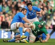 25 February 2012; Sean O'Brien, Ireland, is tackled by Quintin Geldenhuys, Italy. RBS Six Nations Rugby Championship, Ireland v Italy, Aviva Stadium, Lansdowne Road, Dublin. Picture credit: Brendan Moran / SPORTSFILE