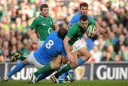 25 February 2012; Tommy Bowe, Ireland, is tackled by Sergio Parisse, Italy. RBS Six Nations Rugby Championship, Ireland v Italy, Aviva Stadium, Lansdowne Road, Dublin. Picture credit: Brendan Moran / SPORTSFILE