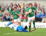 25 February 2012; Andrew Trimble, Ireland, breaks through the tackle of Gonzalo Canale, Italy, on his way to scoring his side's fifth try. RBS Six Nations Rugby Championship, Ireland v Italy, Aviva Stadium, Lansdowne Road, Dublin. Picture credit: David Maher / SPORTSFILE
