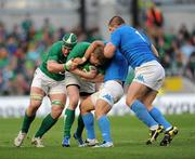 25 February 2012; Keith Earls supported by Sean O'Brien, Ireland, is tackled by Tobias Botes and Michele Rizzo, Italy. RBS Six Nations Rugby Championship, Ireland v Italy, Aviva Stadium, Lansdowne Road, Dublin. Picture credit: Ray McManus / SPORTSFILE