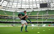 25 February 2012; Ireland's Sean Cronin carries team-mates Fergus McFadden as the substitutes go through their after match warm-down routine. RBS Six Nations Rugby Championship, Ireland v Italy, Aviva Stadium, Lansdowne Road, Dublin. Picture credit: Brendan Moran / SPORTSFILE