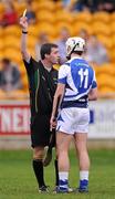 26 February 2012; Referee James Owens shows Michael McEvoy, Laois, his second yellow card before sending him off. Allianz Hurling League, Division 1B, Round 1, Offaly v Laois, O'Connor Park, Tullamore, Co. Offaly. Picture credit: Brian Lawless / SPORTSFILE