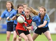 25 June 2017; Deirbhile Lynch of Killygarry, Co. Cavan in action against Westport, Co. Mayo during the Girls Division 1 Shield Final at the John West Peile na nÓg national competition which took place this weekend across Cavan, Fermanagh and Monaghan. This is the second year that the Féile na nGael and Féile Peile na nÓg have been sponsored by John West, one of the world’s leading suppliers of fish. The competition gives up-and-coming GAA superstars the chance to participate and play in their respective Féile tournament, at a level which suits their age, skills and strengths. Photo by Matt Browne/Sportsfile