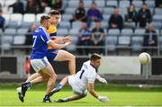 1 July 2017; Jamie Malone of Clare shoots to score his side's first goal of the game despite the efforts of Colm Begley, left, and Graham Brody of Laois during the GAA Football All-Ireland Senior Championship Round 2A match between Laois and Clare at O’Moore Park in Portlaoise, Co Laois. Photo by Ramsey Cardy/Sportsfile